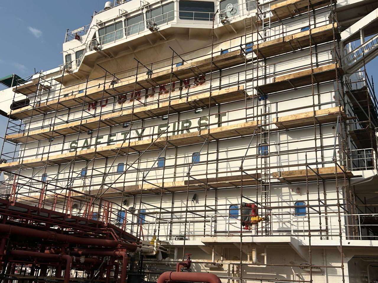 Vessel superstructure with scaffolding during dry-docking works