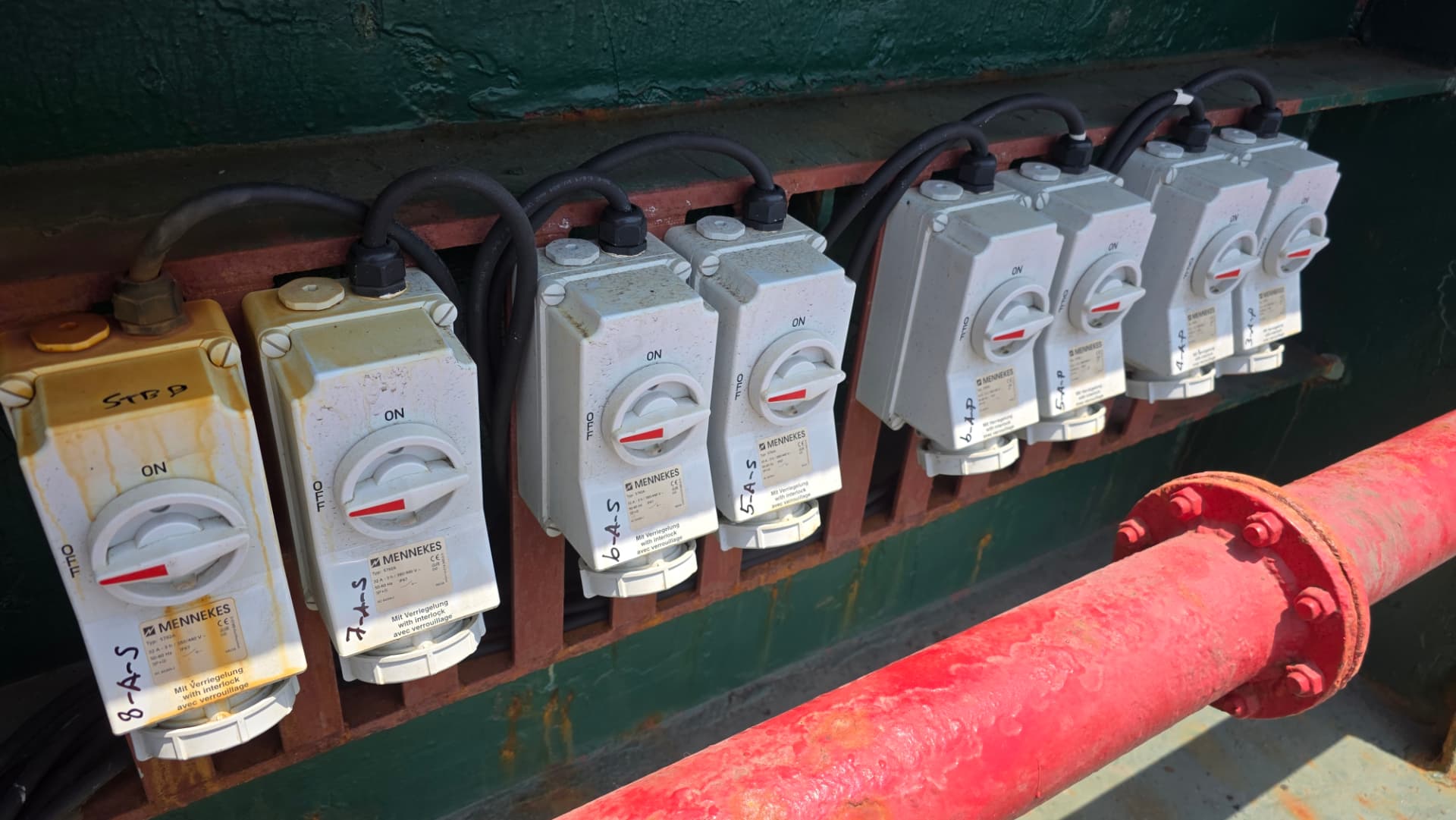 Row of MENNEKES industrial socket outlets with interlock on deck