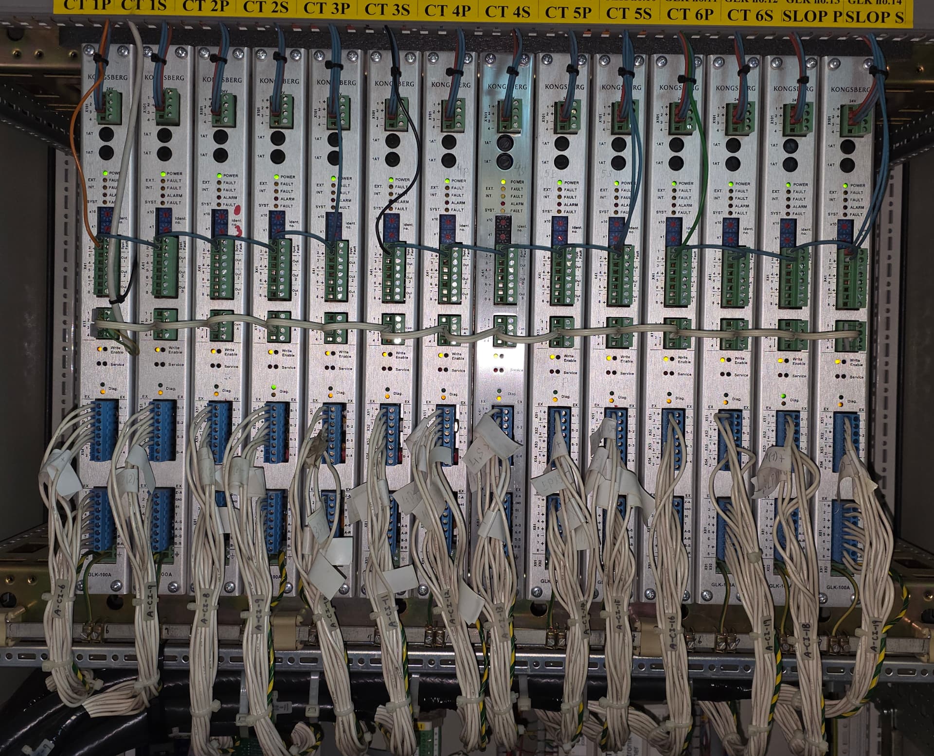 Row of Kongsberg GLK-100A cargo tank monitoring modules wired in cabinet