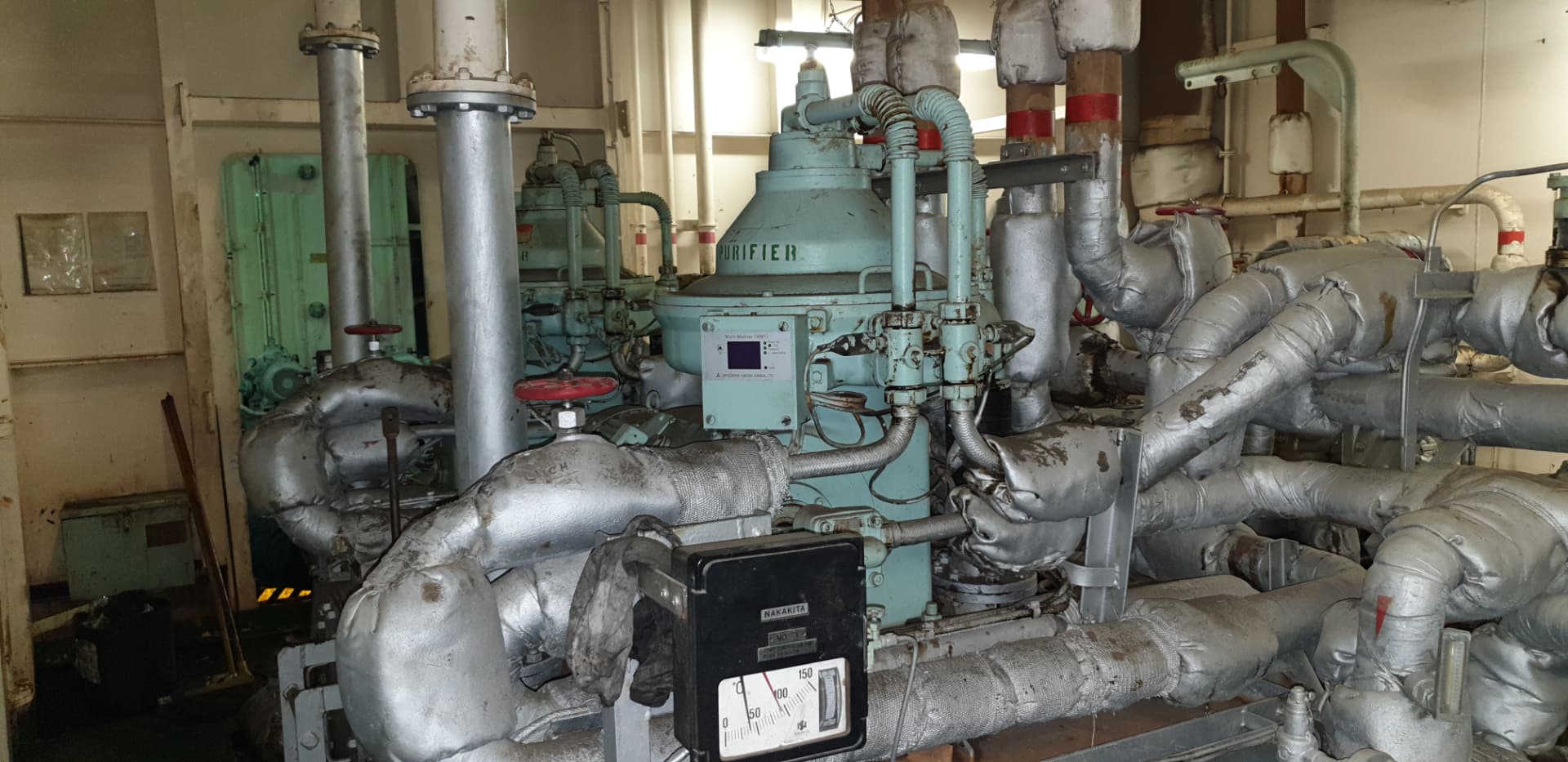 Fuel oil purifier with lagged pipework in engine room