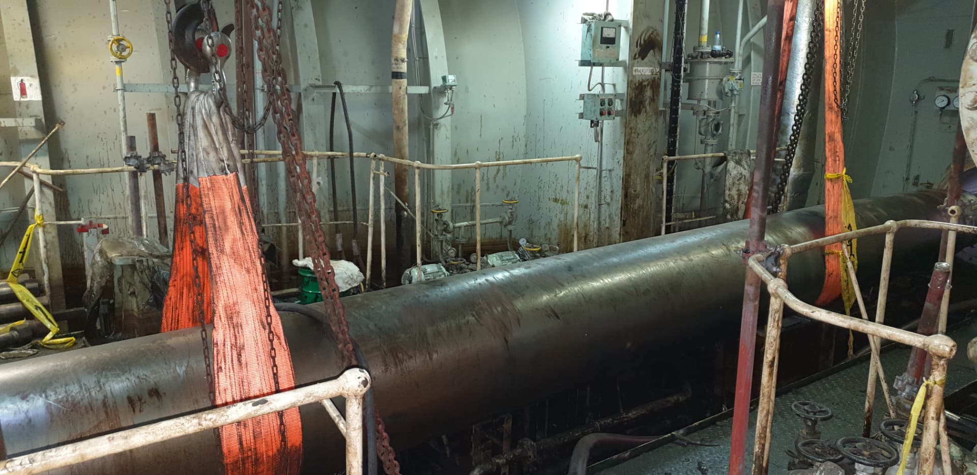 Propulsion shaft lifted with slings during alignment work