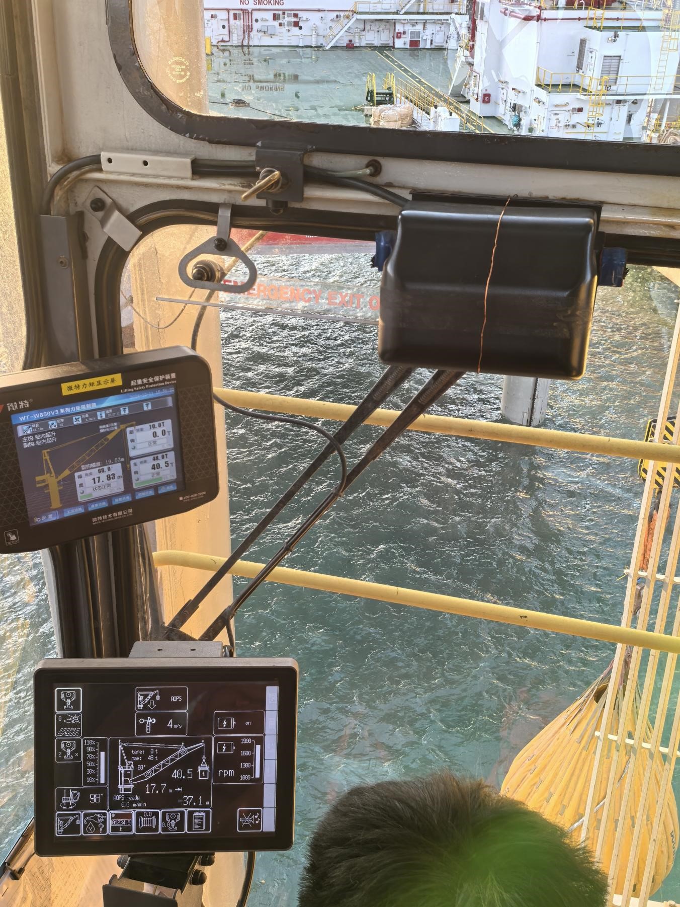 Offshore crane operator cabin with WTAU LMI and AOPS monitoring screens